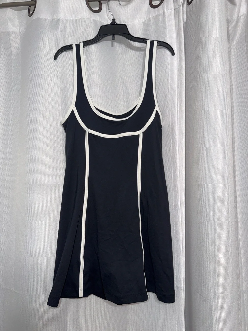 Daily Practice- Black workout dress with white trim and connected spandex shorts